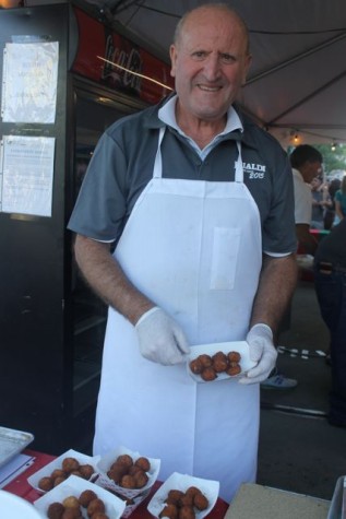 Justo Sarria helps serve croquetas