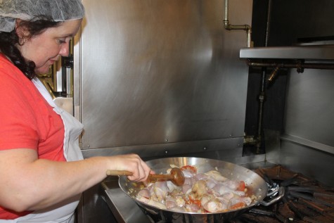Rosa Maria San Mames cooks the chicken early in the paella process.